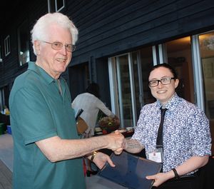 John Bevan, President of Clarion Concerts, receiving Clarion’s award from Margaret Uhalde, Community Arts Grants Coordinator, Greene County Council on the Arts.