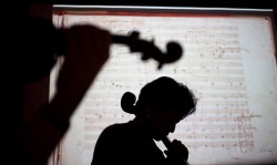 From left, Nicholas Kitchen and Yeesun Kim practice with the Borromeo String Quartet rehearsal at the New England Conservatory.